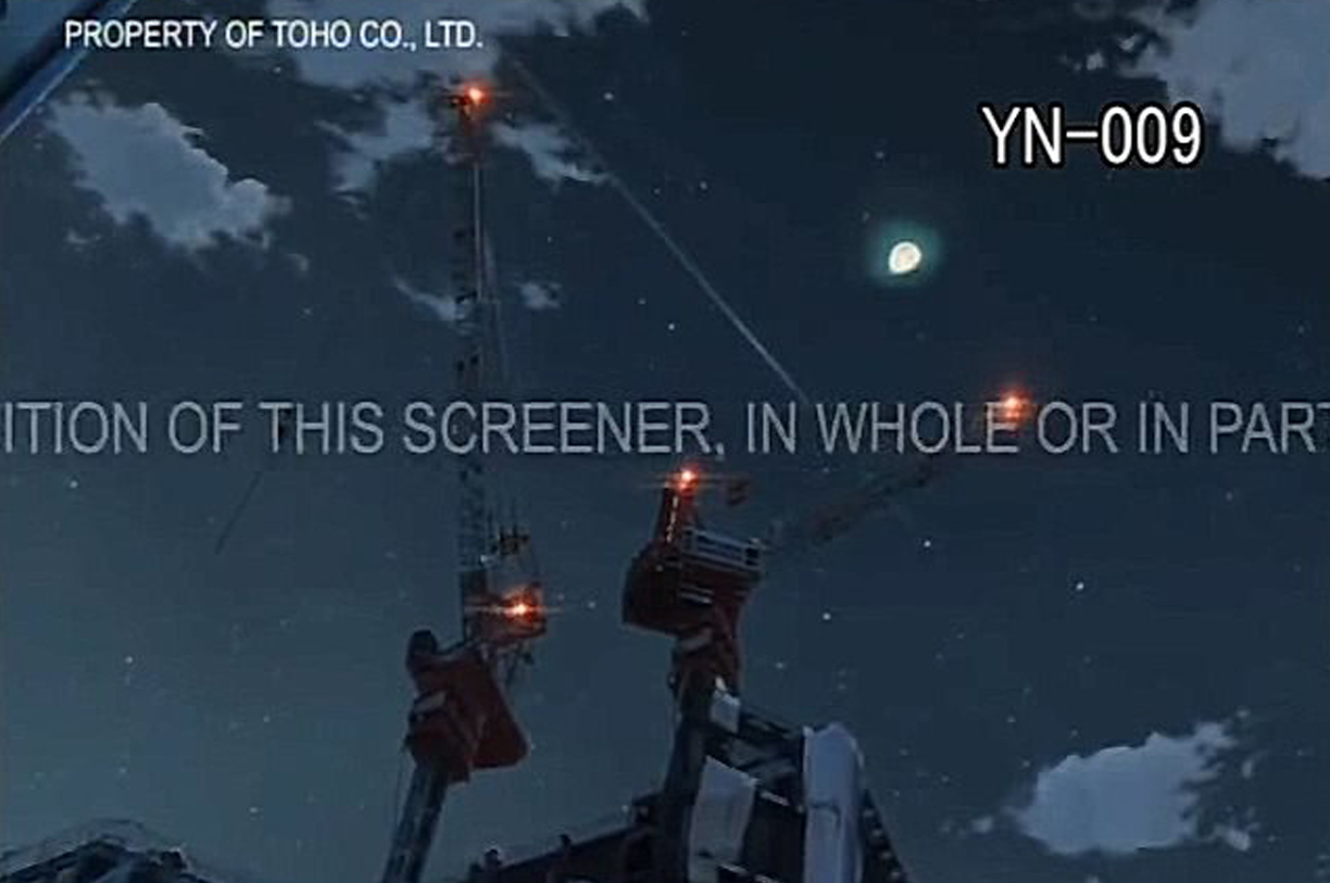 A screencap of the bootleg Your Name DVD showing text scrolling through the middle of the screen, and the code YN-009 in the upper right corner