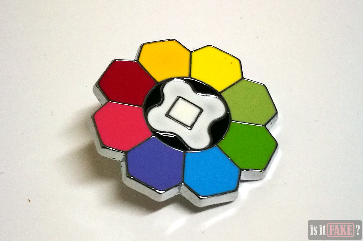 Close-up of fake Pokemon Rainbow badge