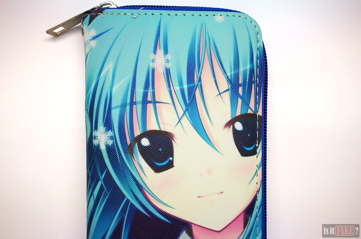 Close-up of fake Hatsune Miku wallet with strap detached