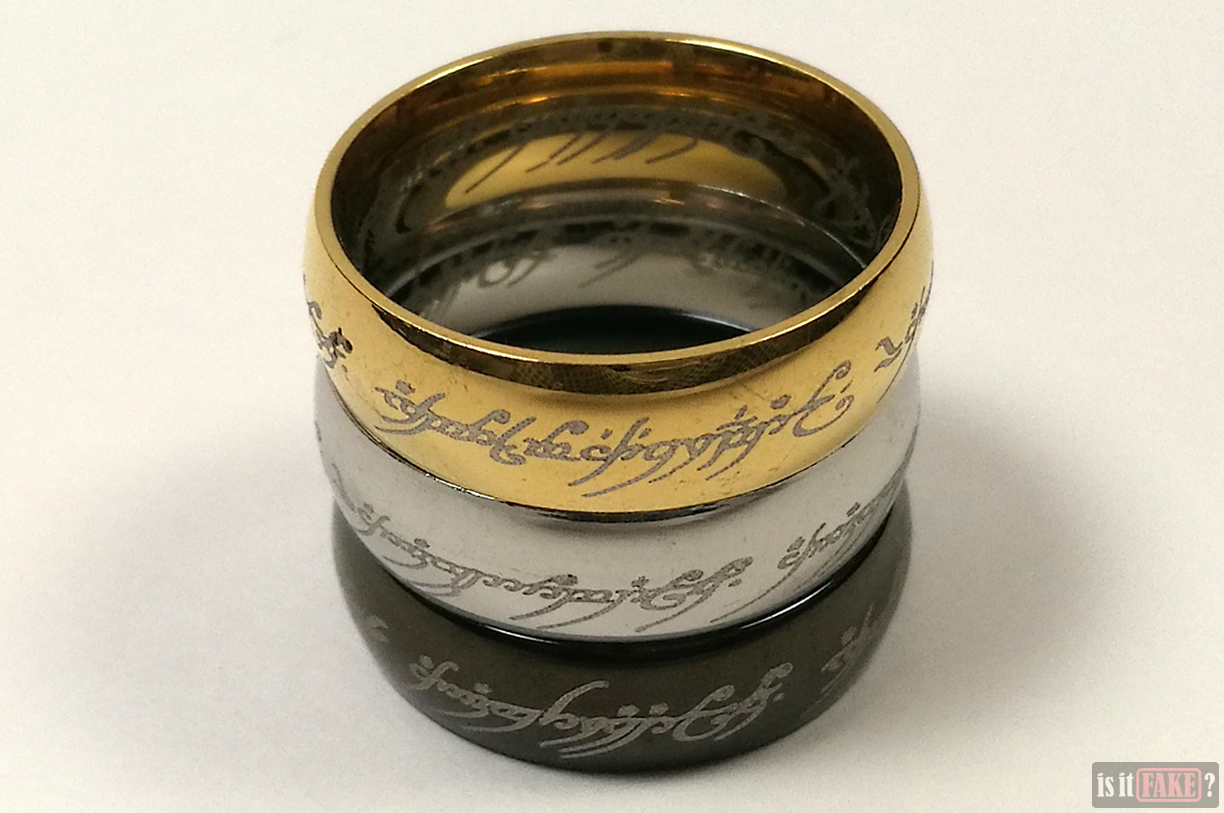 Fake Lord of the Rings gold, silver, and black The One Rings on top of each other