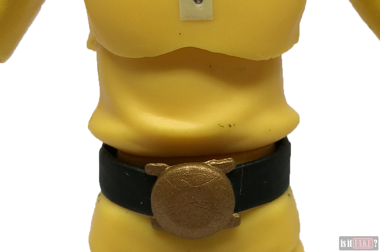 Extreme close-up of fake Figma One Punch Man figure's torso, front view