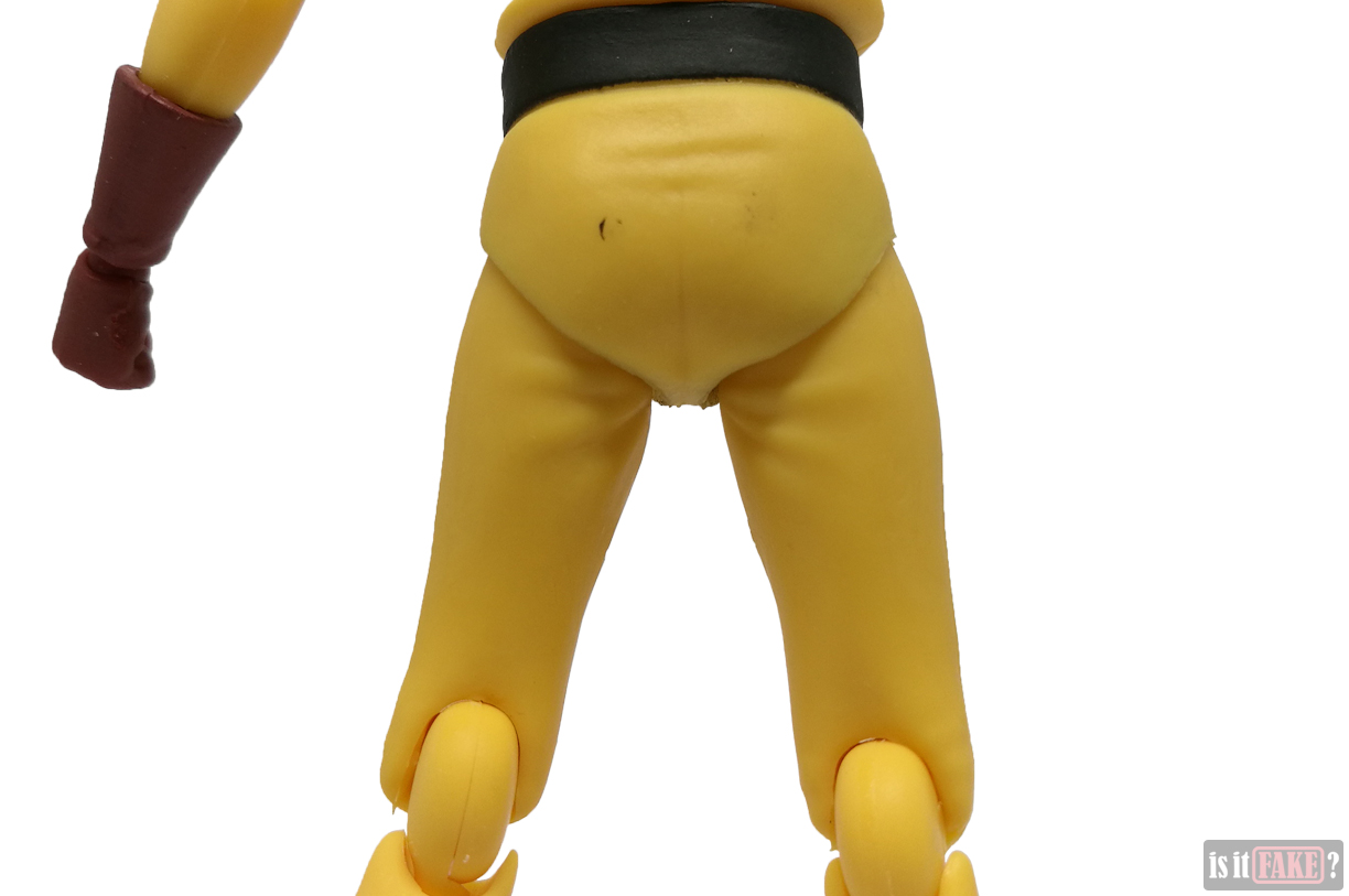 Close-up of fake Figma One Punch Man figure's buttocks and back of thighs