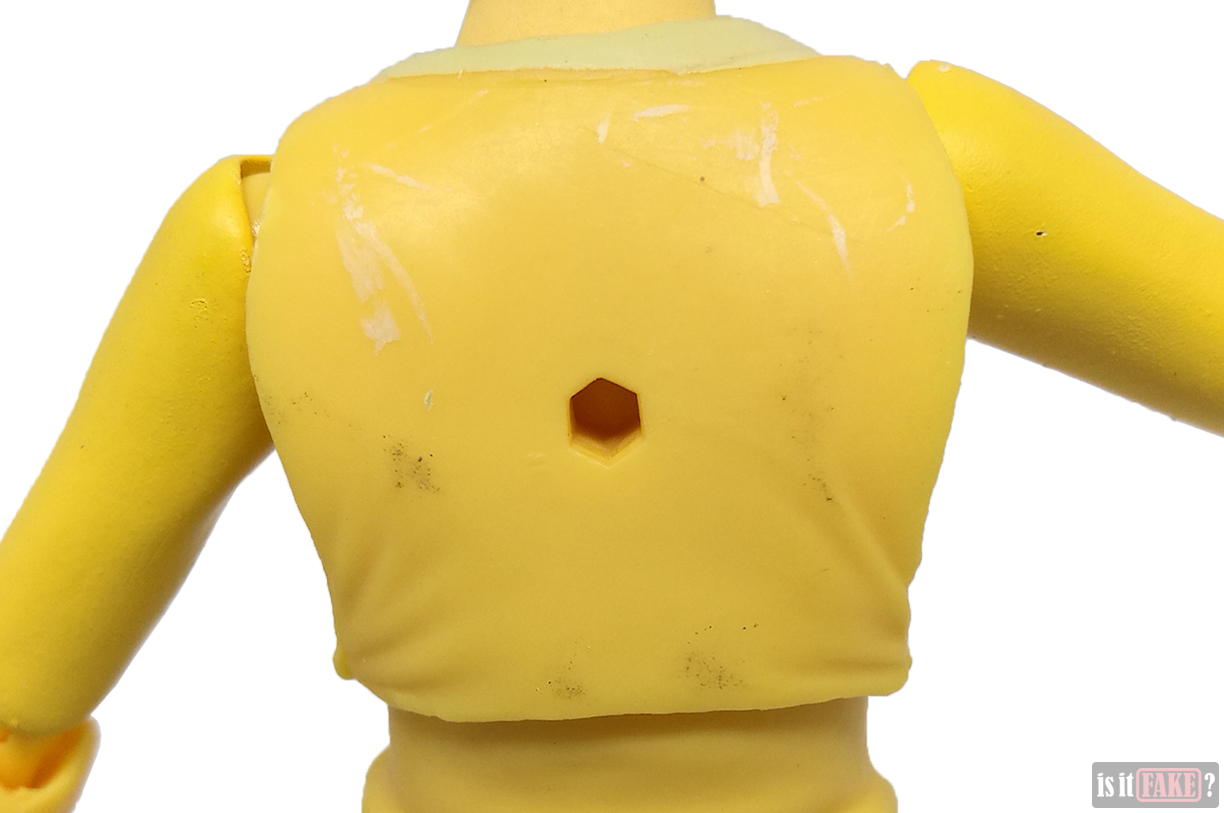 Close-up of fake Figma One Punch Man figure's torso, back view